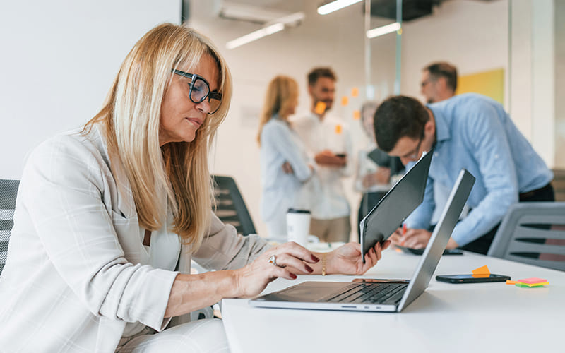 Intelipay finance automation team collaborating in a modern office environment